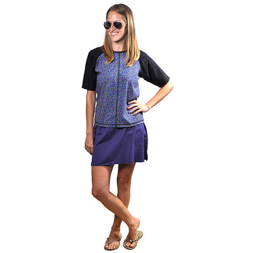 petite fleur flower pattern short sleeve swim and sports top UV rashguard with round neck and  with black sleeve detail featuring a blue swim skirt - MarSea Modest